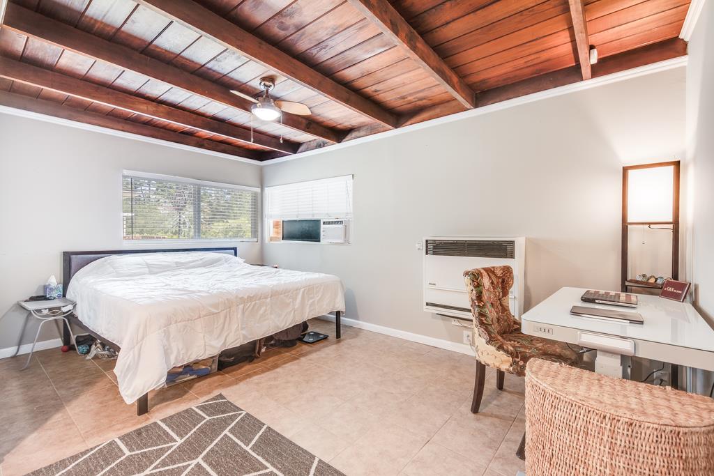 22930 Summit Road Los Gatos, CA 95033 - Photo 50 of 50 a bedroom with a bed a table and chair