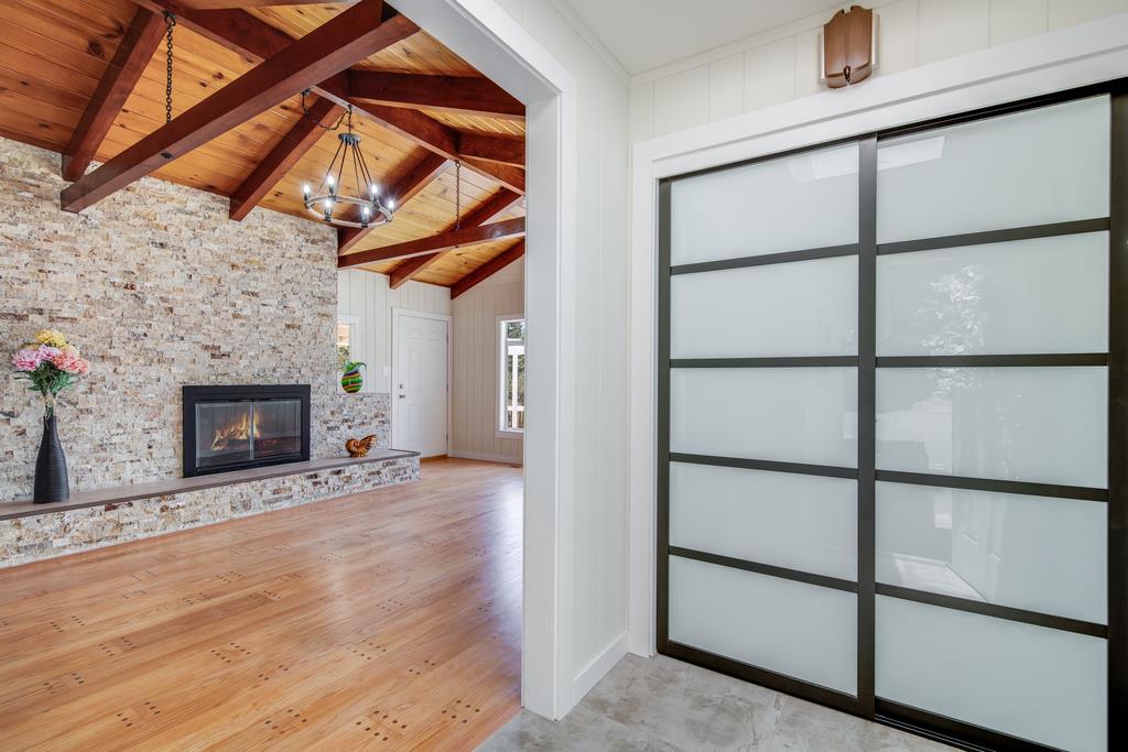 22930 Summit Road Los Gatos, CA 95033 - Photo 10 of 50 a view of an empty room with a fireplace and a window