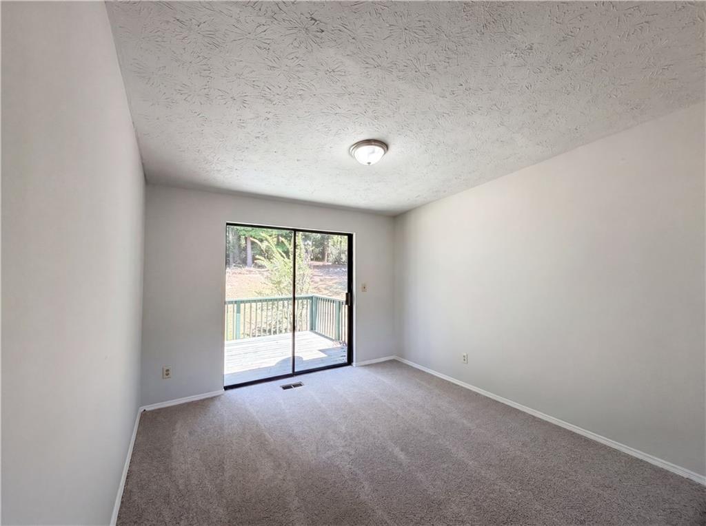 6830 Earlhurst Road Atlanta, GA 30349 - Photo 18 of 27 an empty room with windows