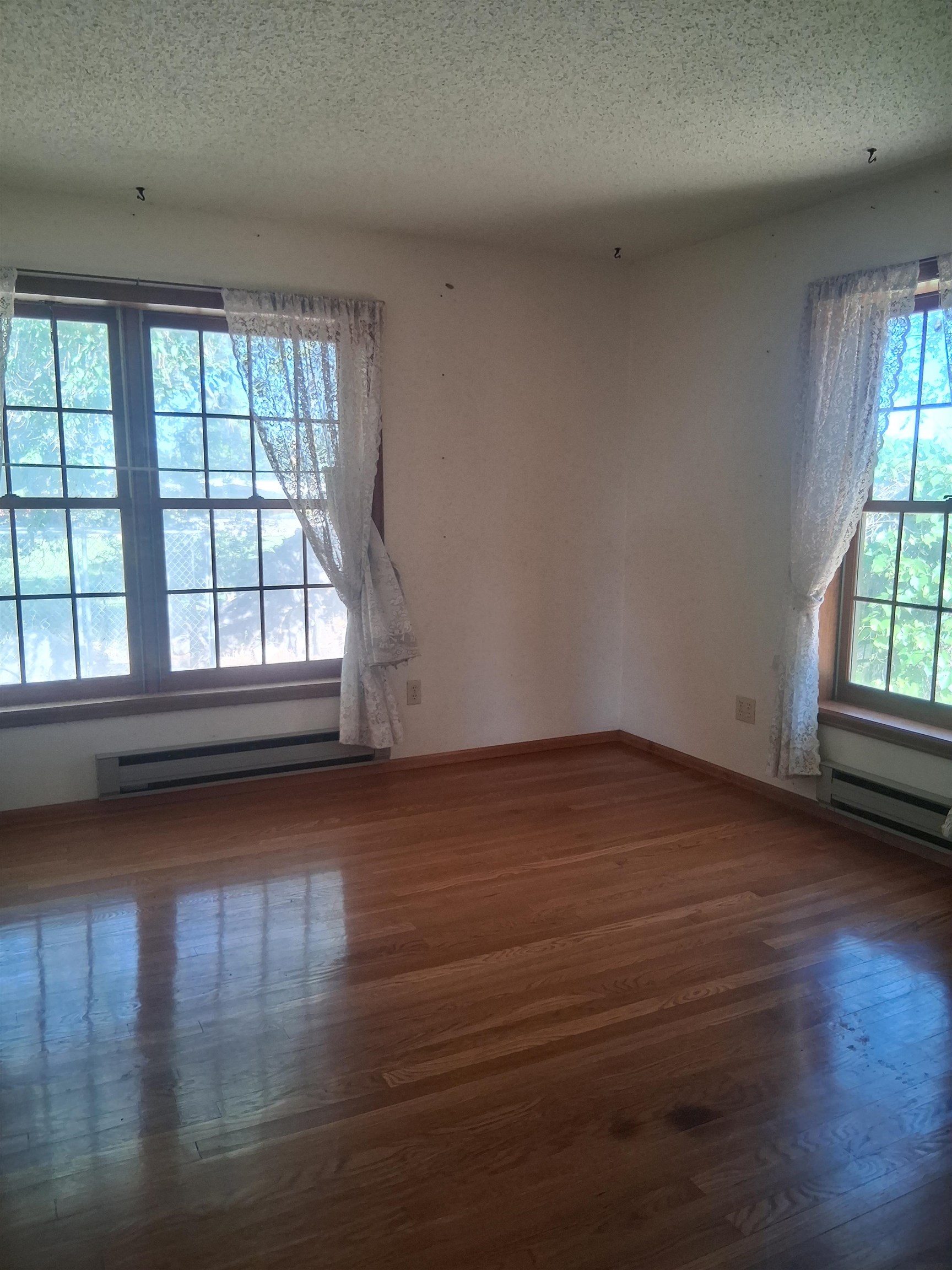 1983 River Road Fruita, CO 81521 - Photo 24 of 31 an empty room with wooden floor and windows