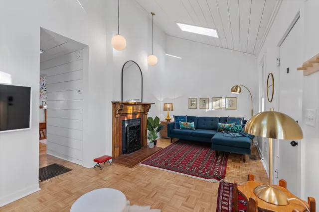 a living room with furniture and a fireplace