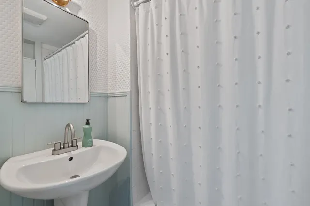 a bathroom with a sink and vanity