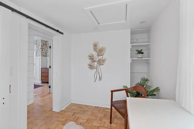 a workspace with furniture and window