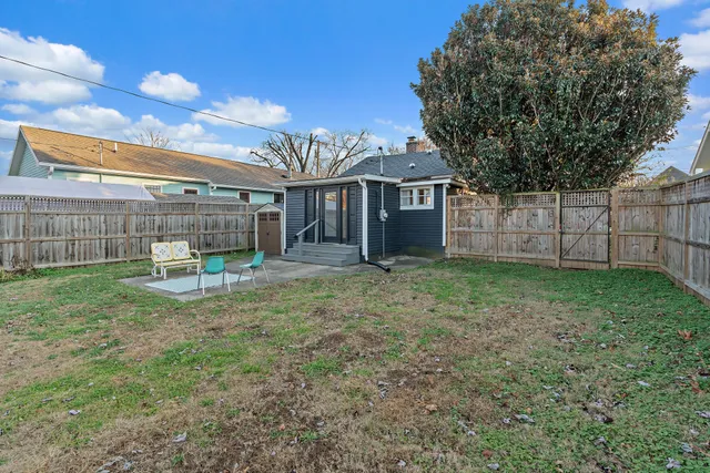 a view of a house with a backyard