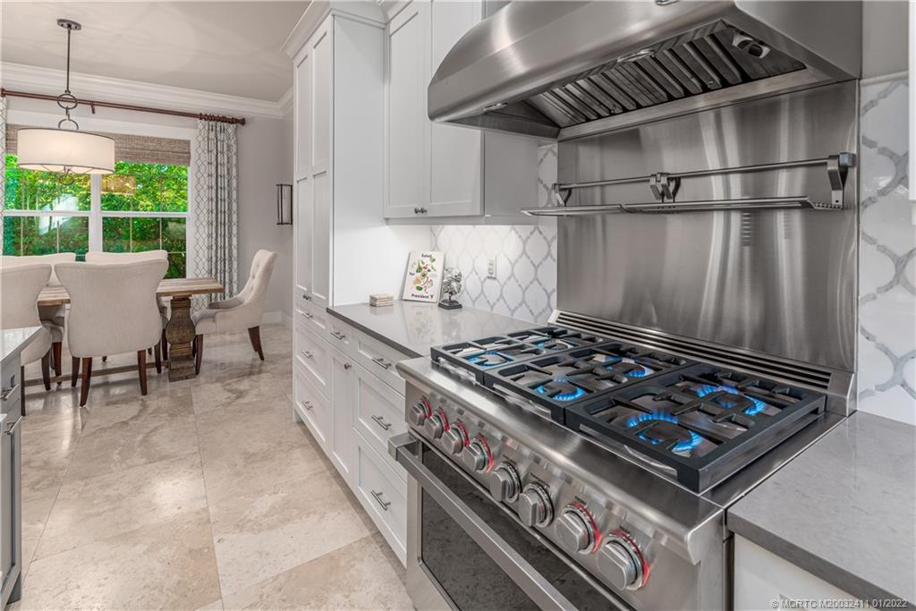 213 Coconut Avenue Stuart, FL 34996 - Photo 20 of 27 a stove top oven sitting inside of a kitchen