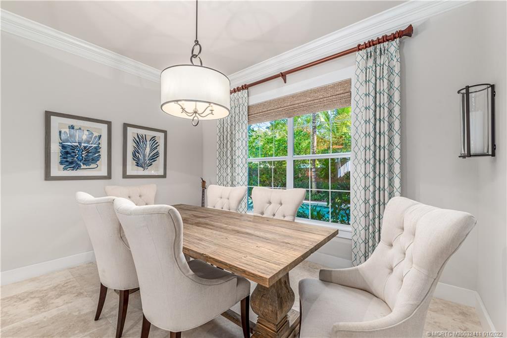 213 Coconut Avenue Stuart, FL 34996 - Photo 23 of 27 a view of a dining room with furniture window and outside view