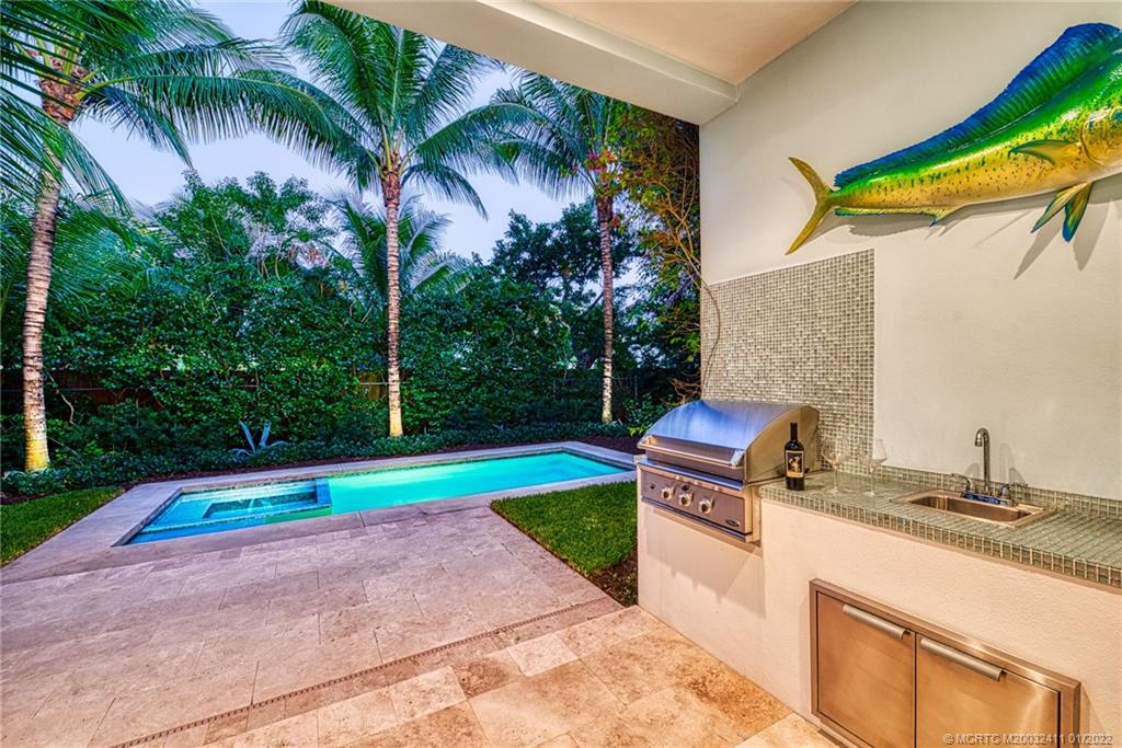 213 Coconut Avenue Stuart, FL 34996 - Photo 6 of 27 a backyard of a house with outdoor seating