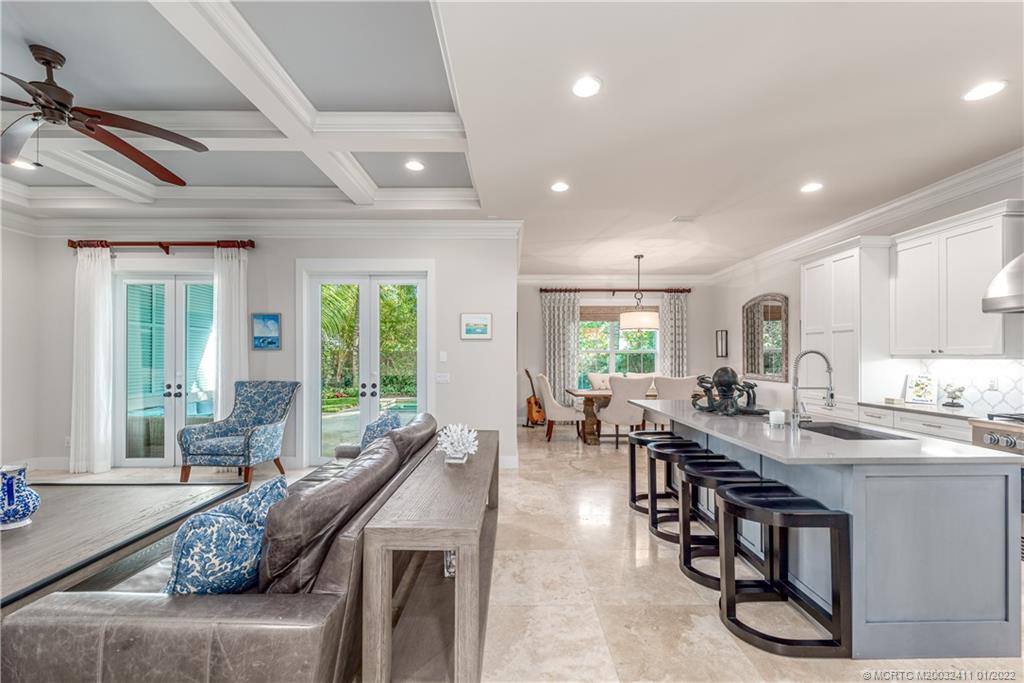 213 Coconut Avenue Stuart, FL 34996 - Photo 7 of 27 a room with lots of tables a large window and chairs