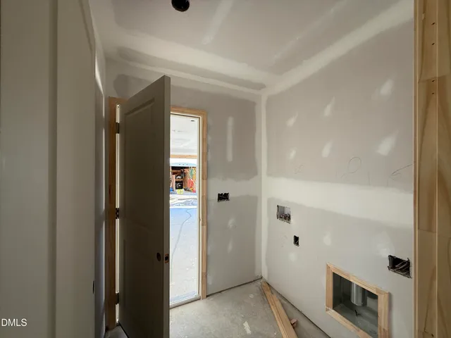 a view of a hallway to rooms