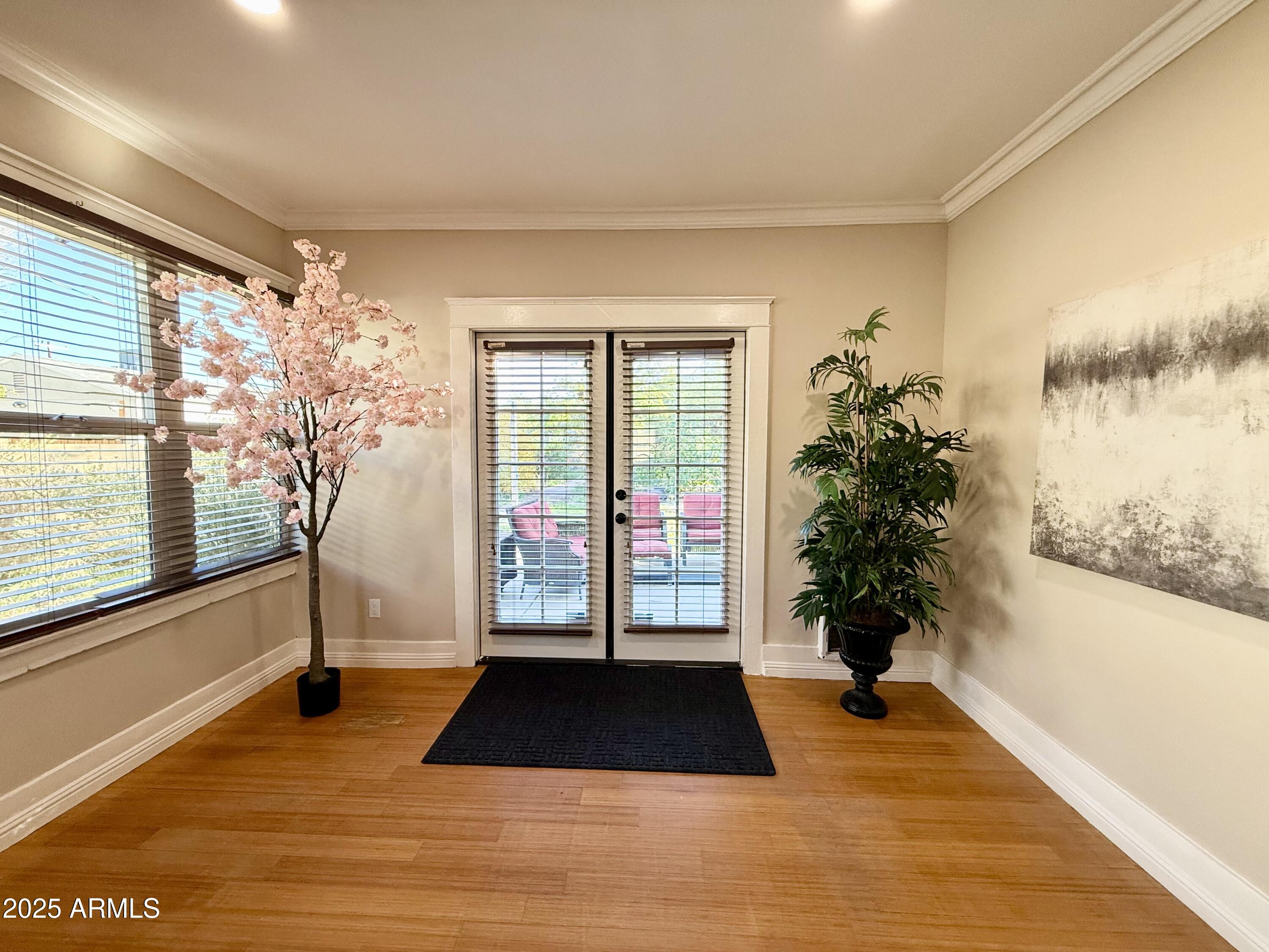 723 East Moreland Street Phoenix, AZ 85006 - Photo 12 of 25 a room with a potted plant and floor to ceiling window