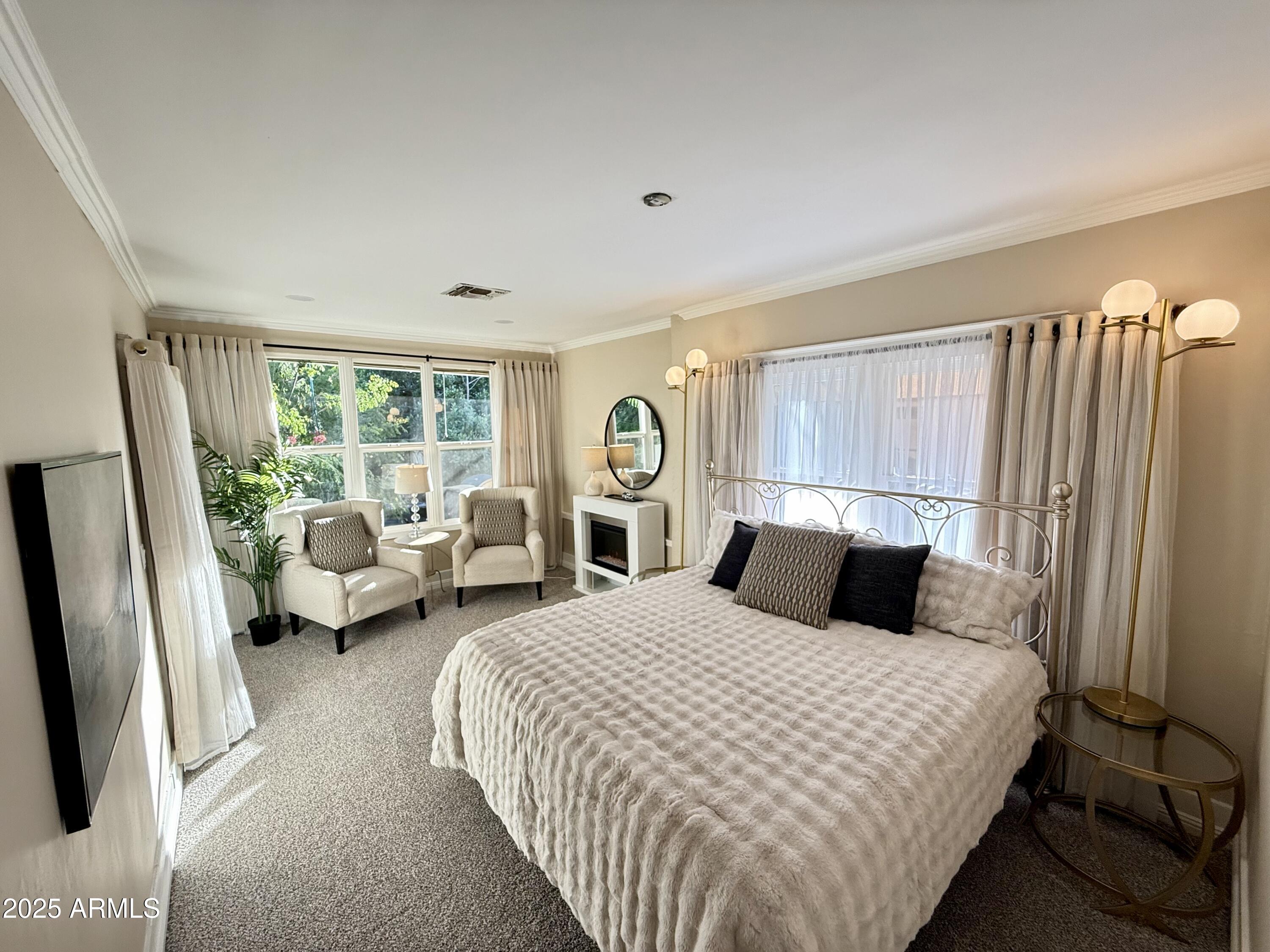 723 East Moreland Street Phoenix, AZ 85006 - Photo 13 of 25 a bedroom with a bed couch and a window
