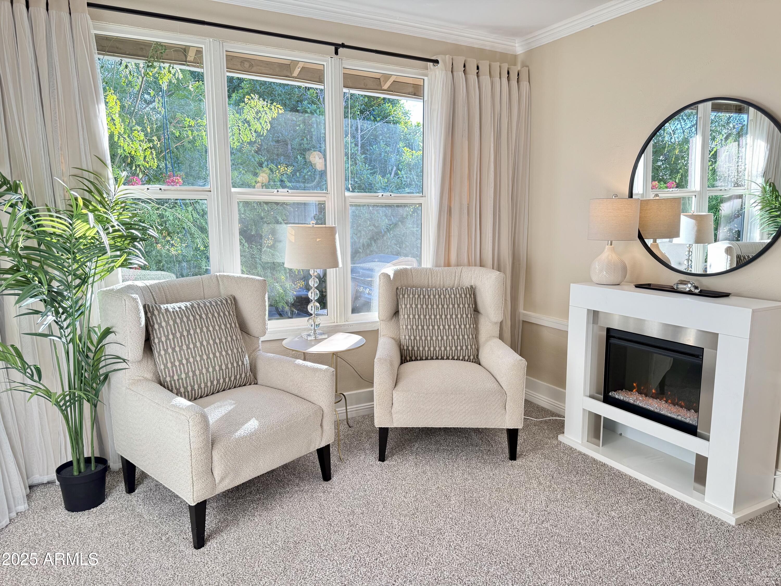 723 East Moreland Street Phoenix, AZ 85006 - Photo 14 of 25 a living room with furniture a large window and a fireplace