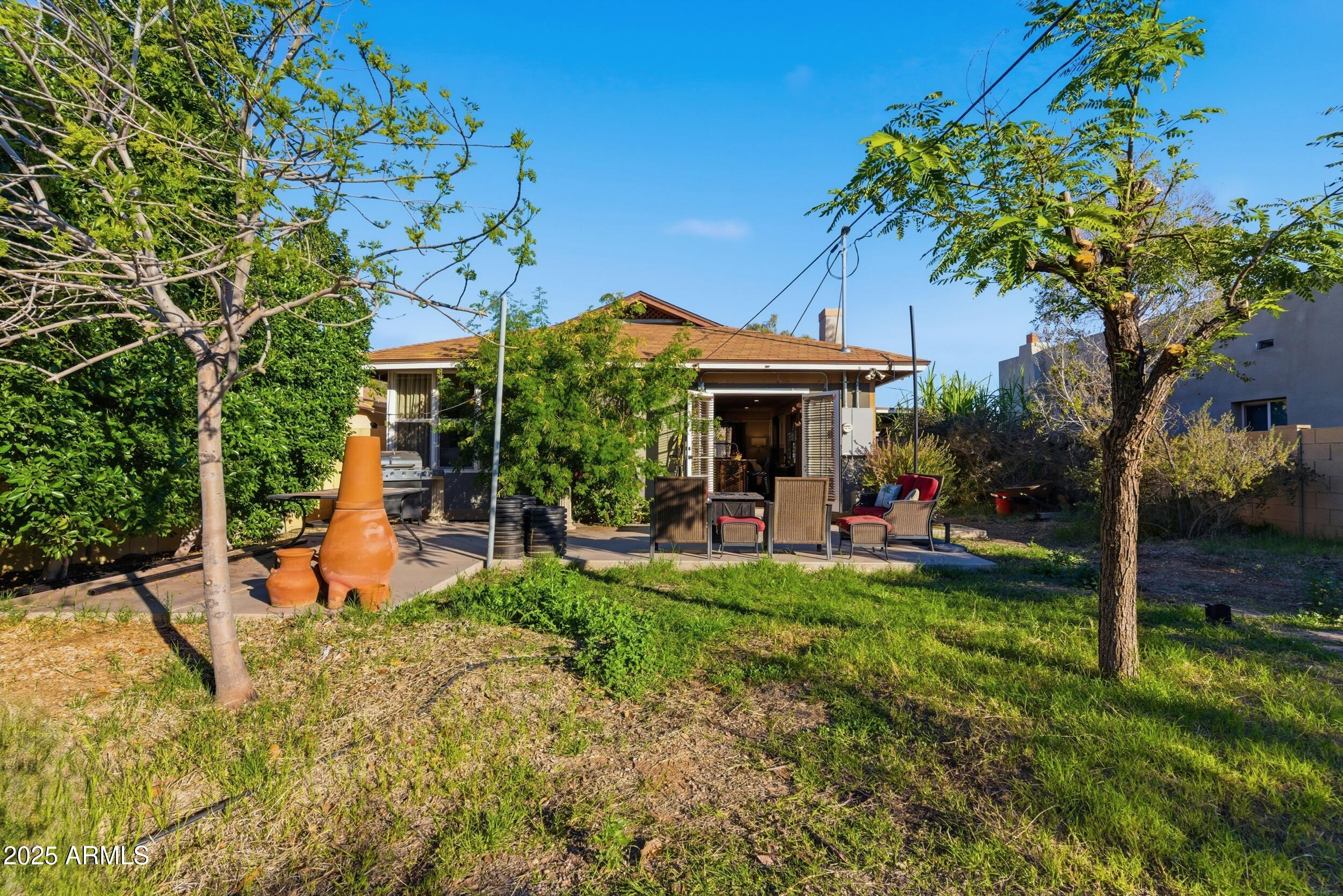 723 East Moreland Street Phoenix, AZ 85006 - Photo 22 of 25 a view of a house with backyard porch and sitting area
