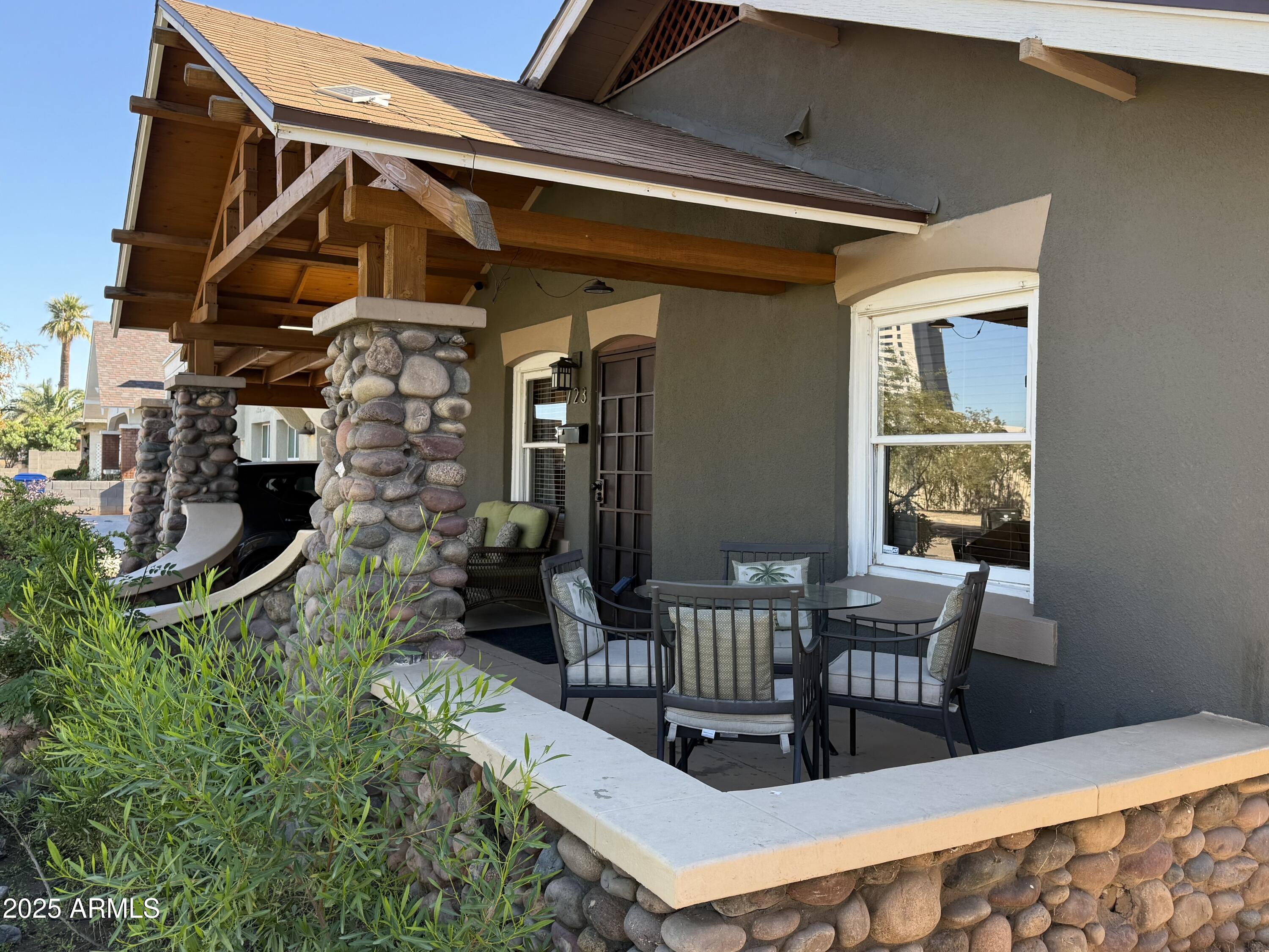 723 East Moreland Street Phoenix, AZ 85006 - Photo 3 of 25 a view of a chair and table in the patio