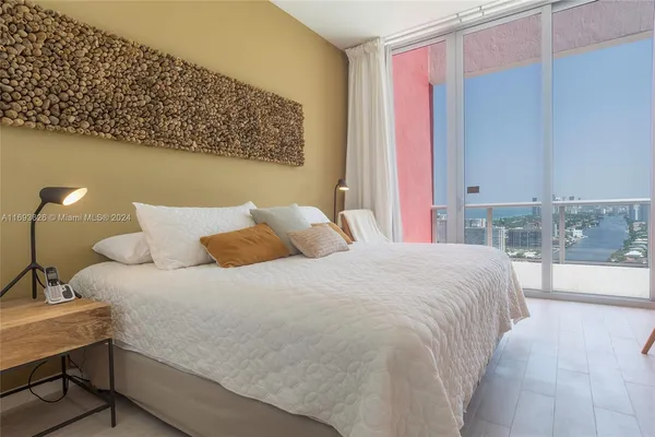 a bedroom with a bed and a table