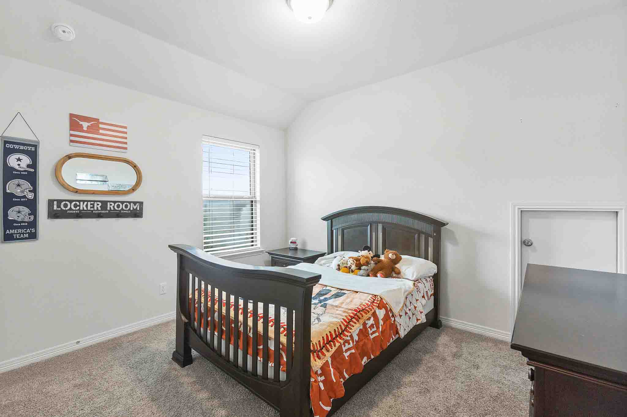166 West Branch Road Kyle, TX 78640 - Photo 26 of 39 A well-lit bedroom provides a comfortable and private retreat for relaxation.
