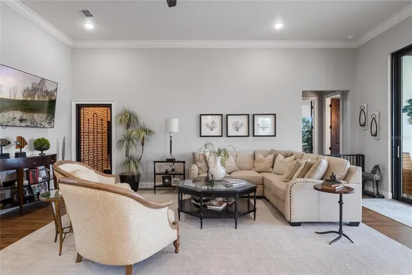 a spacious bedroom with a bed and ceiling fan