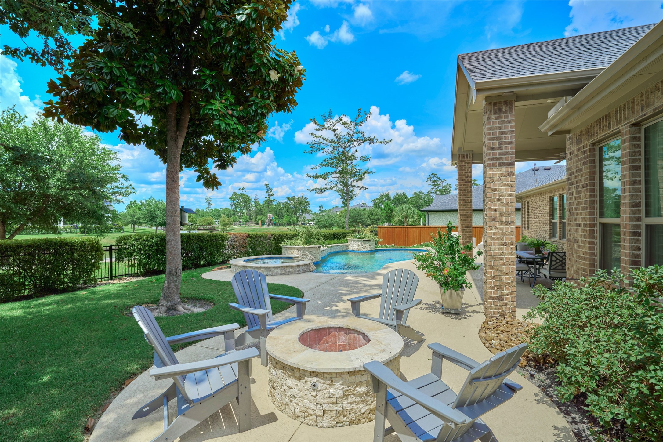 10090 South Goshawk Trail Conroe, TX 77385 - Photo 39 of 43 Enjoy the fire pit conversation area.