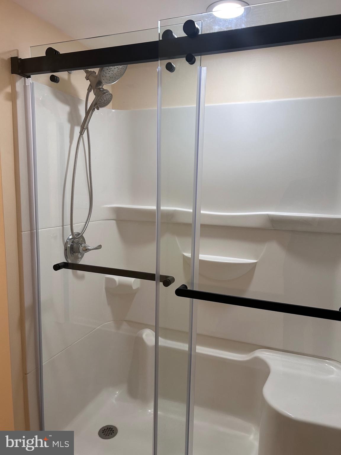 7617 Windsor Mill Road Windsor Mill, MD 21244 - Photo 20 of 49 a bathroom with a glass shower door