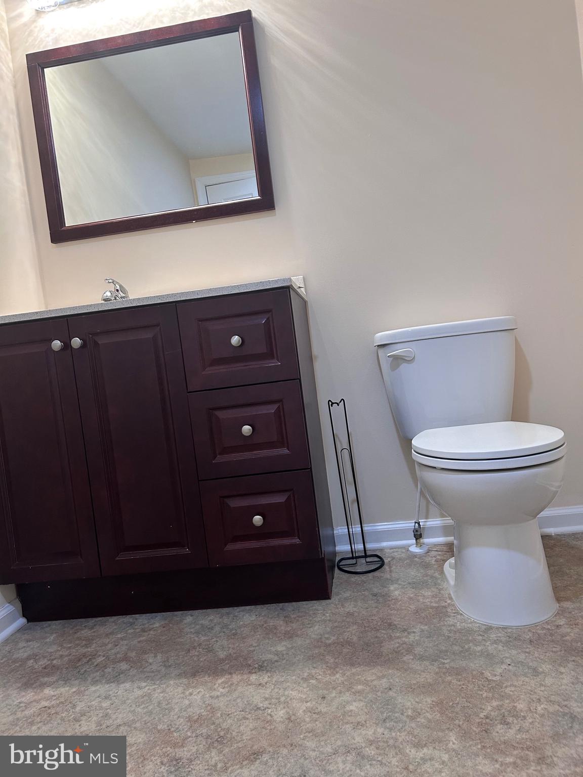 7617 Windsor Mill Road Windsor Mill, MD 21244 - Photo 24 of 49 a bathroom with a toilet and a mirror