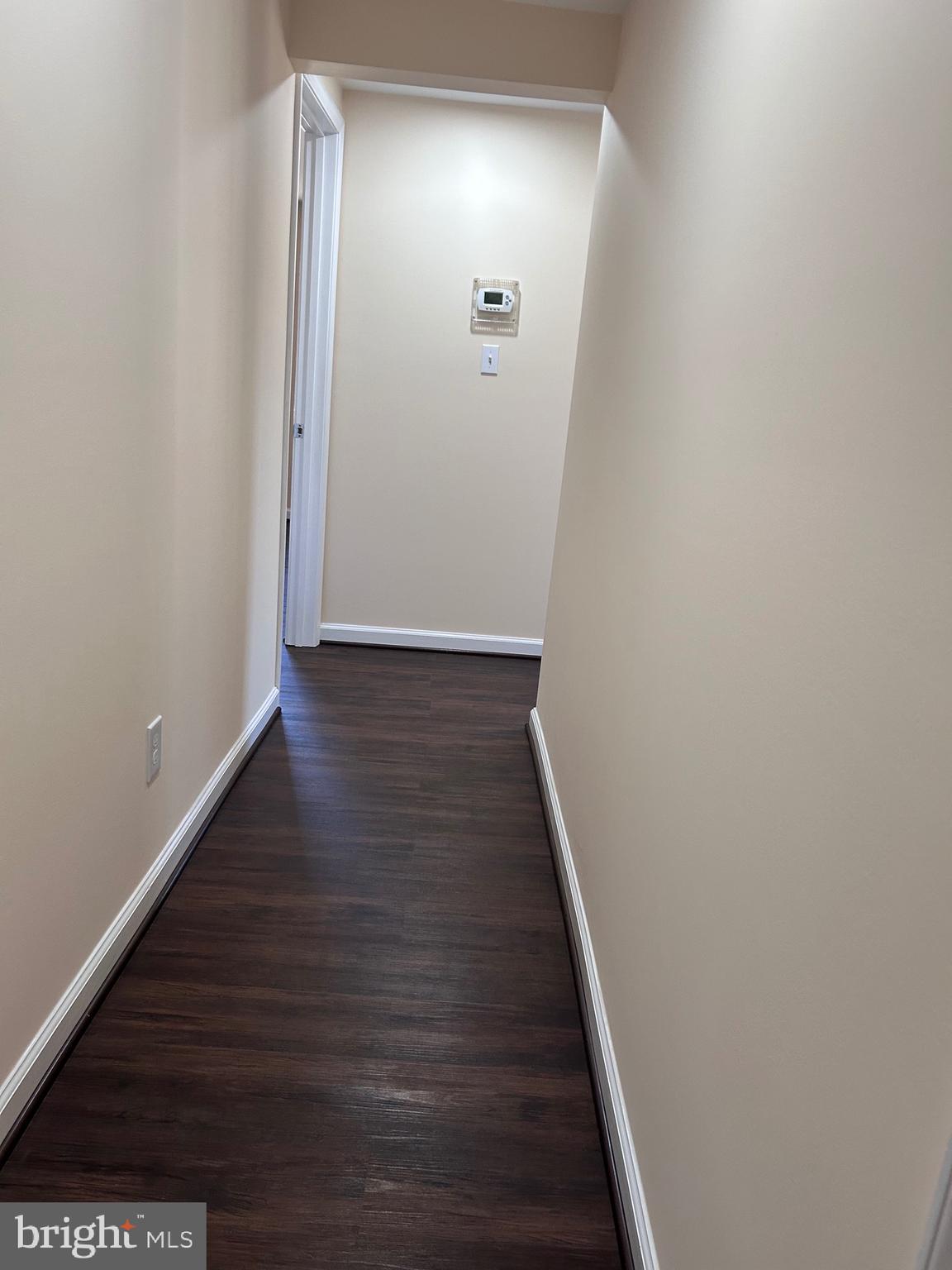 7617 Windsor Mill Road Windsor Mill, MD 21244 - Photo 29 of 49 a view of a hallway with wooden floor