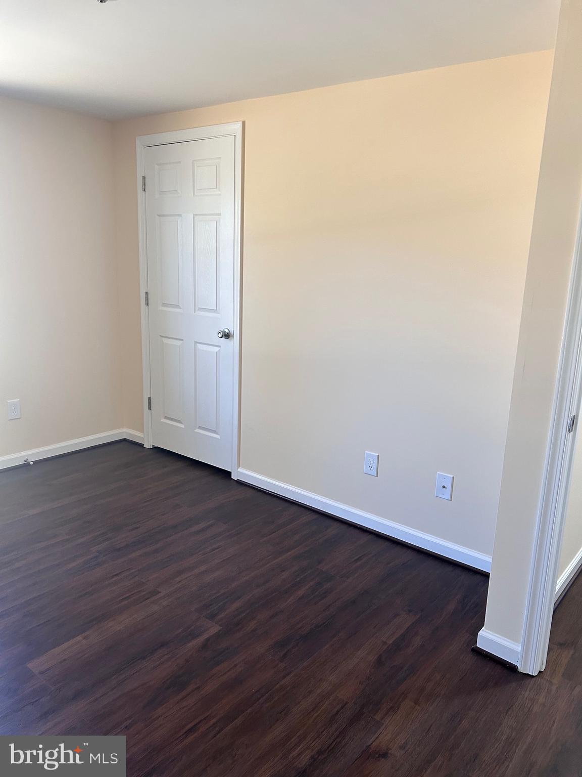 7617 Windsor Mill Road Windsor Mill, MD 21244 - Photo 30 of 49 a view of an empty room with wooden floor