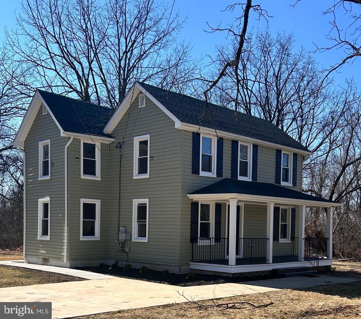 7617 Windsor Mill Road Windsor Mill, MD 21244 - Photo 4 of 49 a front view of a house with a yard