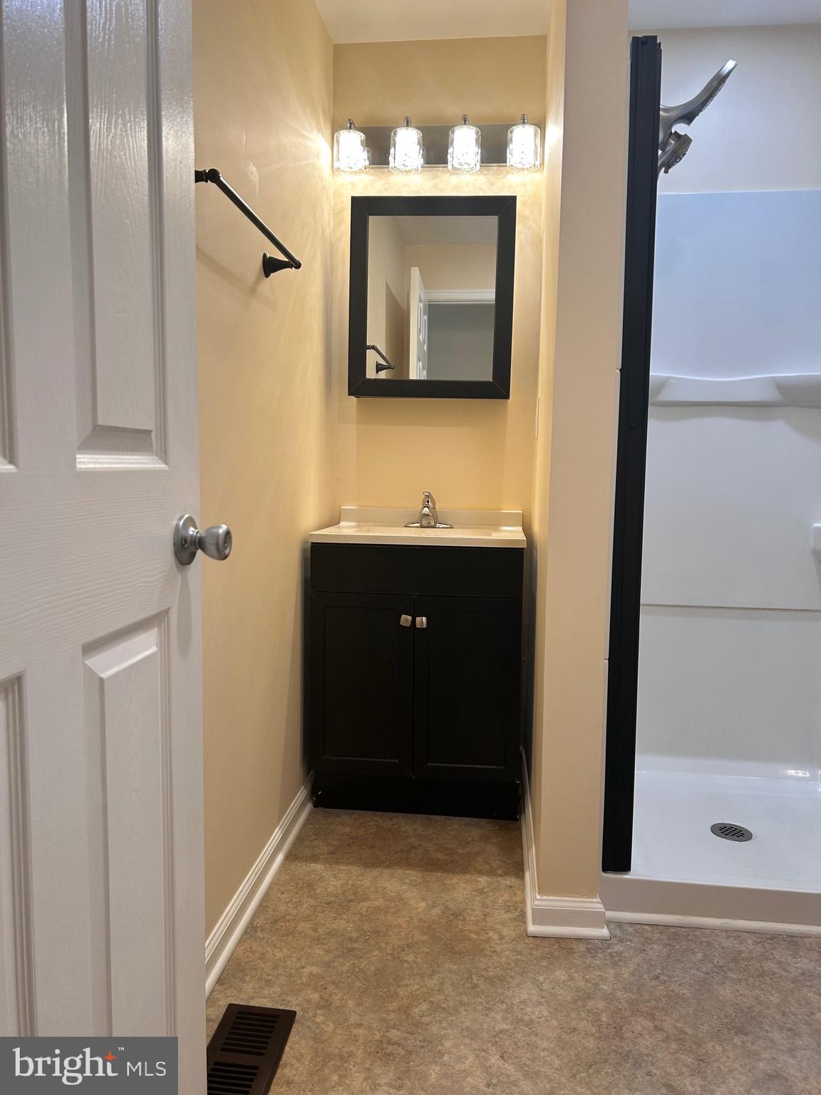 7617 Windsor Mill Road Windsor Mill, MD 21244 - Photo 41 of 49 a bathroom with a sink and a mirror