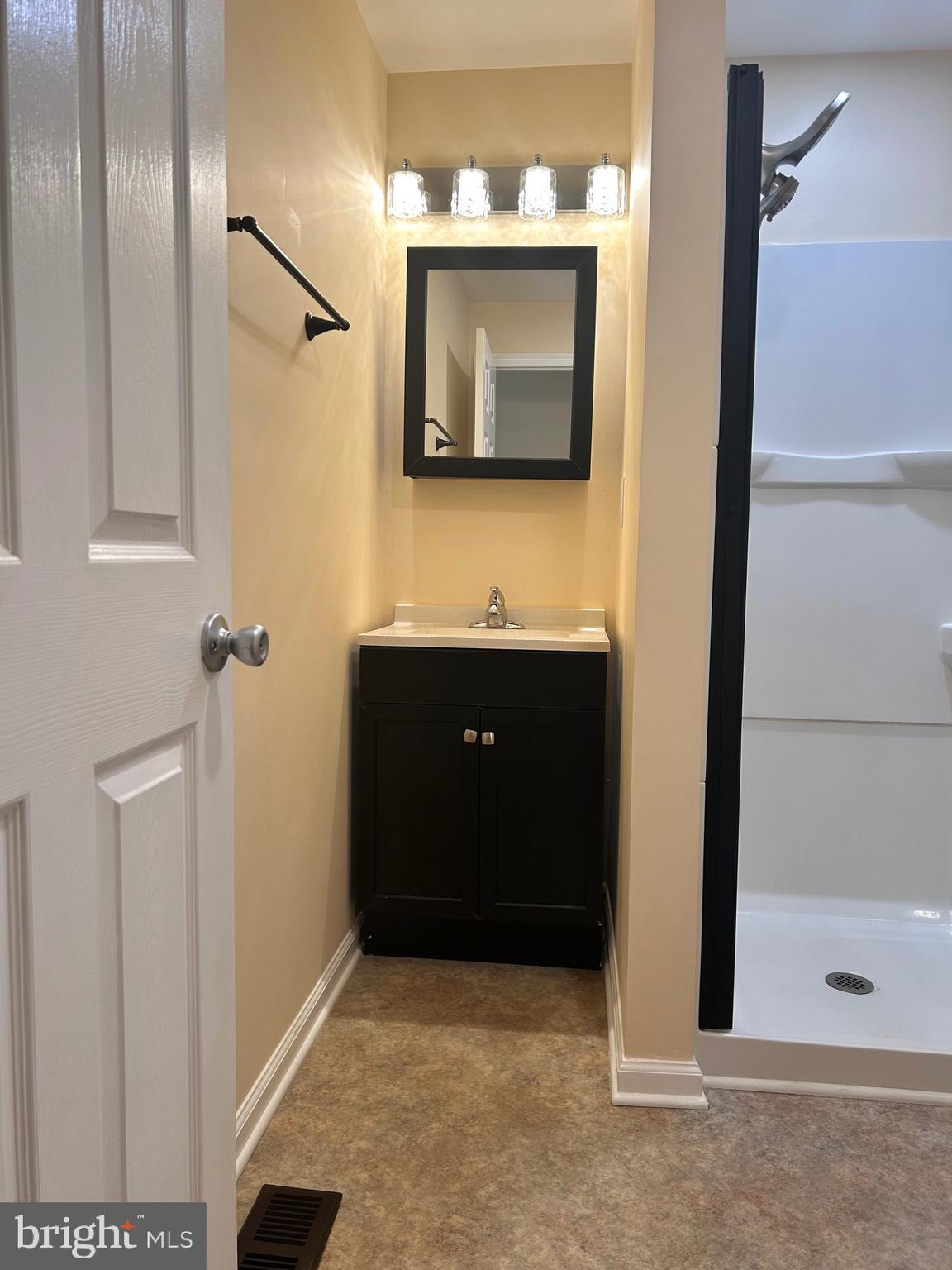 7617 Windsor Mill Road Windsor Mill, MD 21244 - Photo 42 of 49 a bathroom with a sink and a mirror