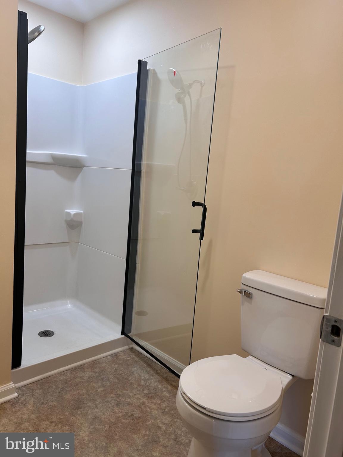 7617 Windsor Mill Road Windsor Mill, MD 21244 - Photo 43 of 49 a white toilet sitting next to a bathroom sink