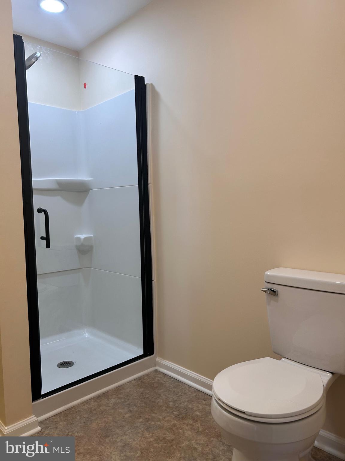 7617 Windsor Mill Road Windsor Mill, MD 21244 - Photo 44 of 49 a bathroom with a toilet and a shower