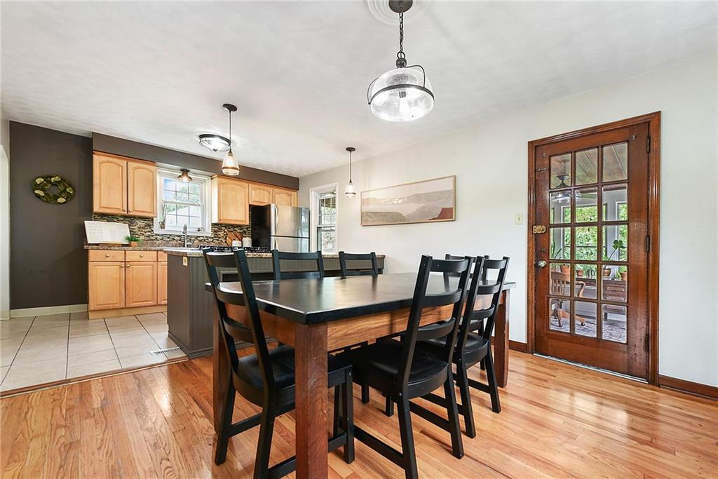 4043 Shoreham Street Pittsburgh, PA 15212 - Photo 13 of 45 a view of a dining room with furniture window and wooden floor