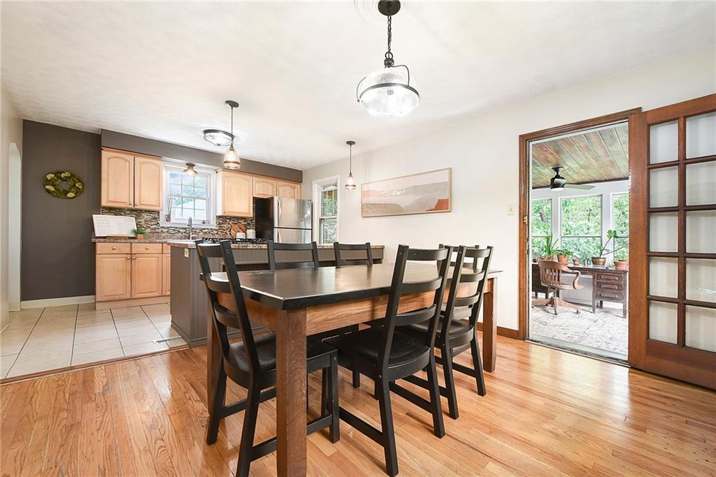 4043 Shoreham Street Pittsburgh, PA 15212 - Photo 14 of 45 a view of a dining room with furniture and wooden floor