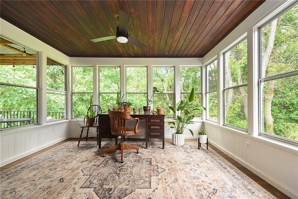 4043 Shoreham Street Pittsburgh, PA 15212 - Photo 21 of 45 a living room filled with furniture and a large window