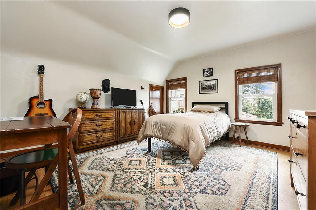 4043 Shoreham Street Pittsburgh, PA 15212 - Photo 27 of 45 a spacious bedroom with a bed and wooden floor