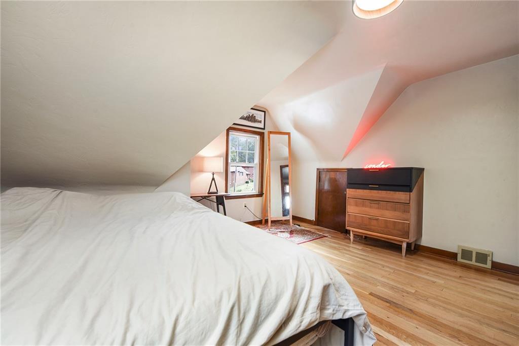 4043 Shoreham Street Pittsburgh, PA 15212 - Photo 32 of 45 a bed room with a bed and a view of kitchen