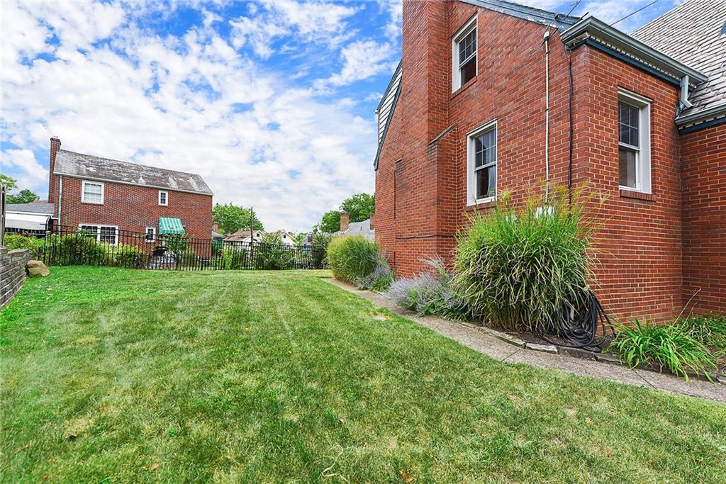 4043 Shoreham Street Pittsburgh, PA 15212 - Photo 40 of 45 a view of a brick building next to a yard