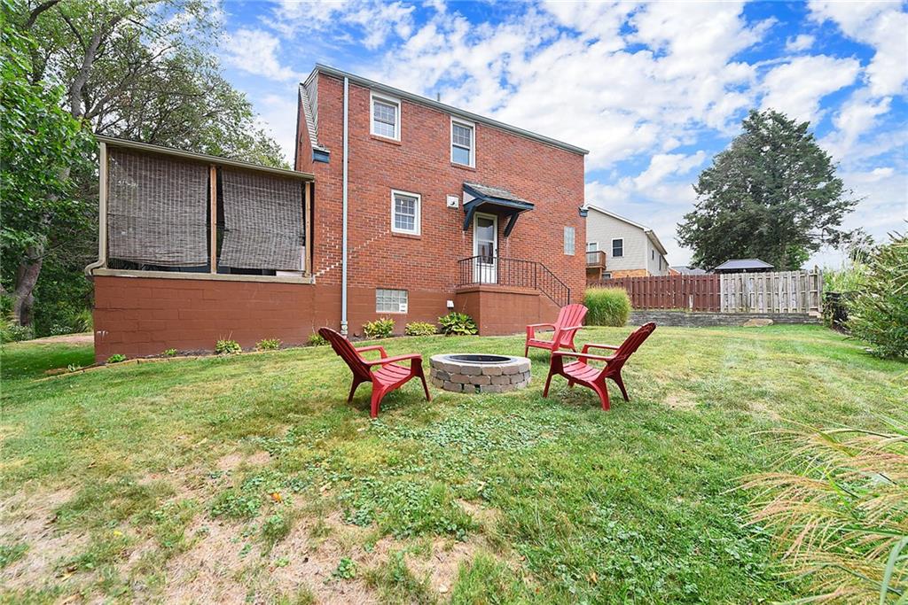 4043 Shoreham Street Pittsburgh, PA 15212 - Photo 43 of 45 a backyard of a house with table and chairs