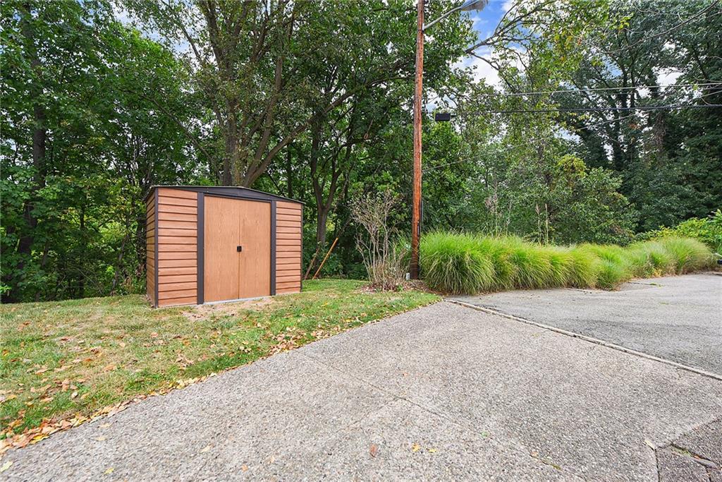 4043 Shoreham Street Pittsburgh, PA 15212 - Photo 45 of 45 a backyard of a house with plants and trees