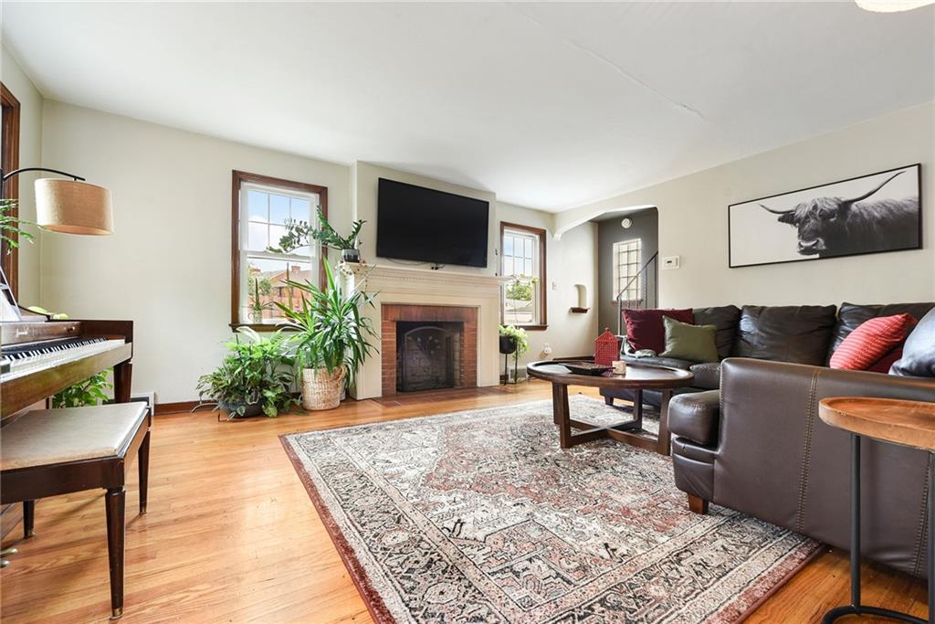 4043 Shoreham Street Pittsburgh, PA 15212 - Photo 5 of 45 a living room with furniture and a fireplace