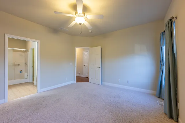 an empty room with a bathroom