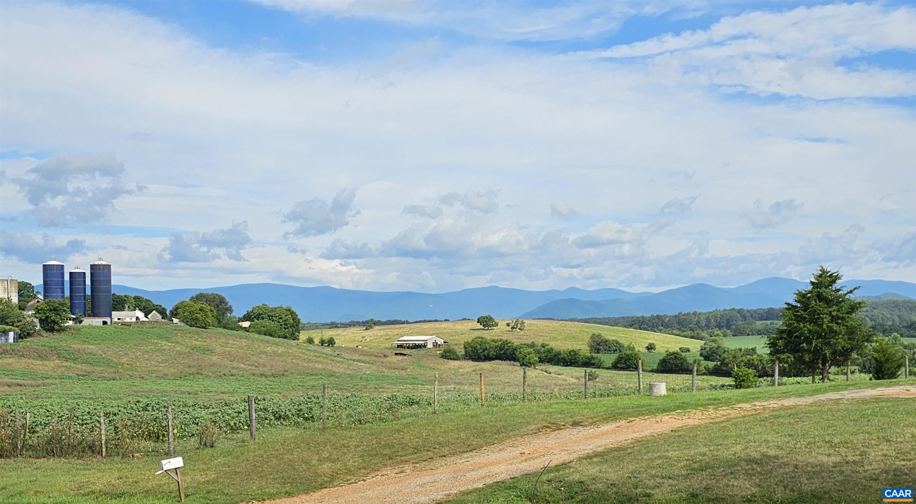 Lot 7 Fredericksburg Road Ruckersville, VA 22968 - Photo 2 of 6 a view of a city with green field