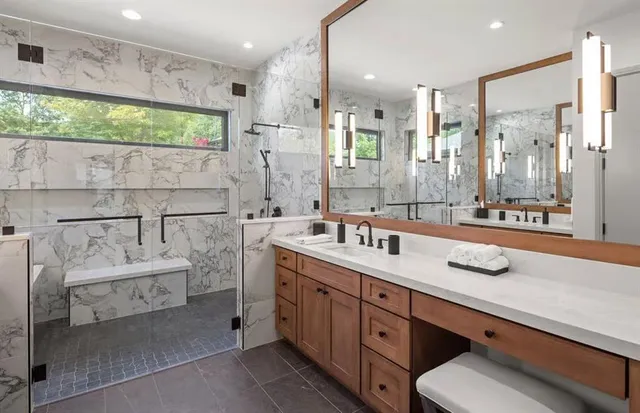 a bathroom with a double vanity sink mirror and