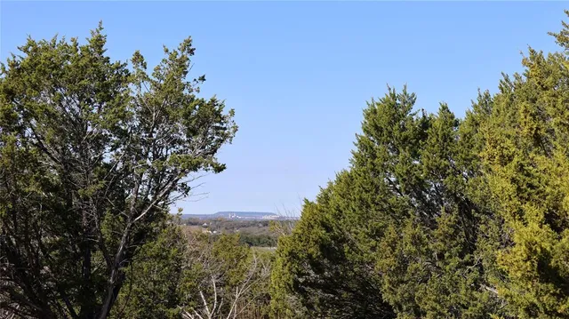 an aerial view of house with mountain view