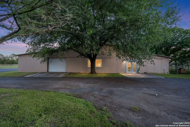a house view with a backyard space