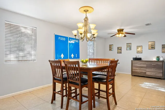 a dining room with furniture and window