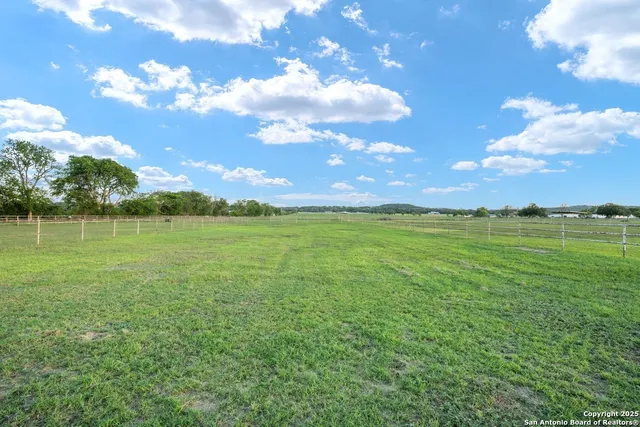 a view of a lake with a big yard