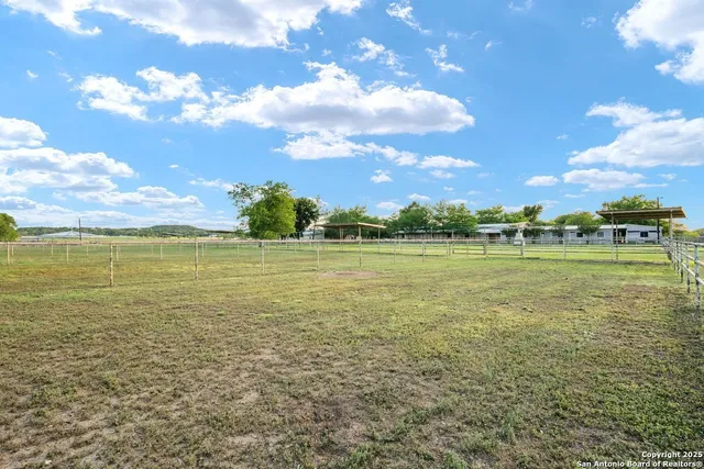 a view of a lake with houses in the back