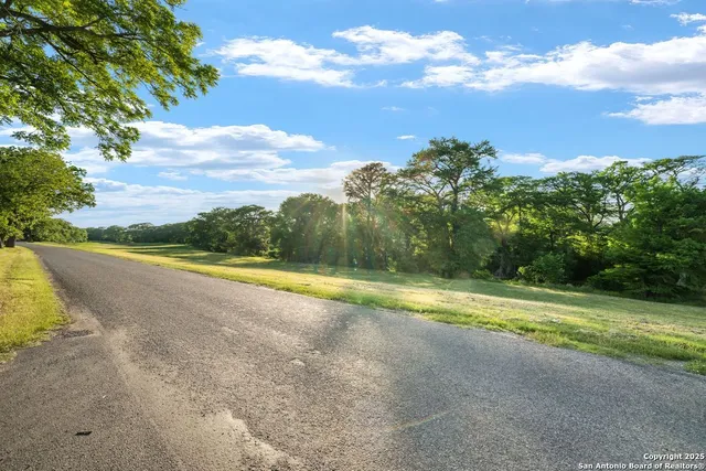 a view of a house with swimming pool and a yard