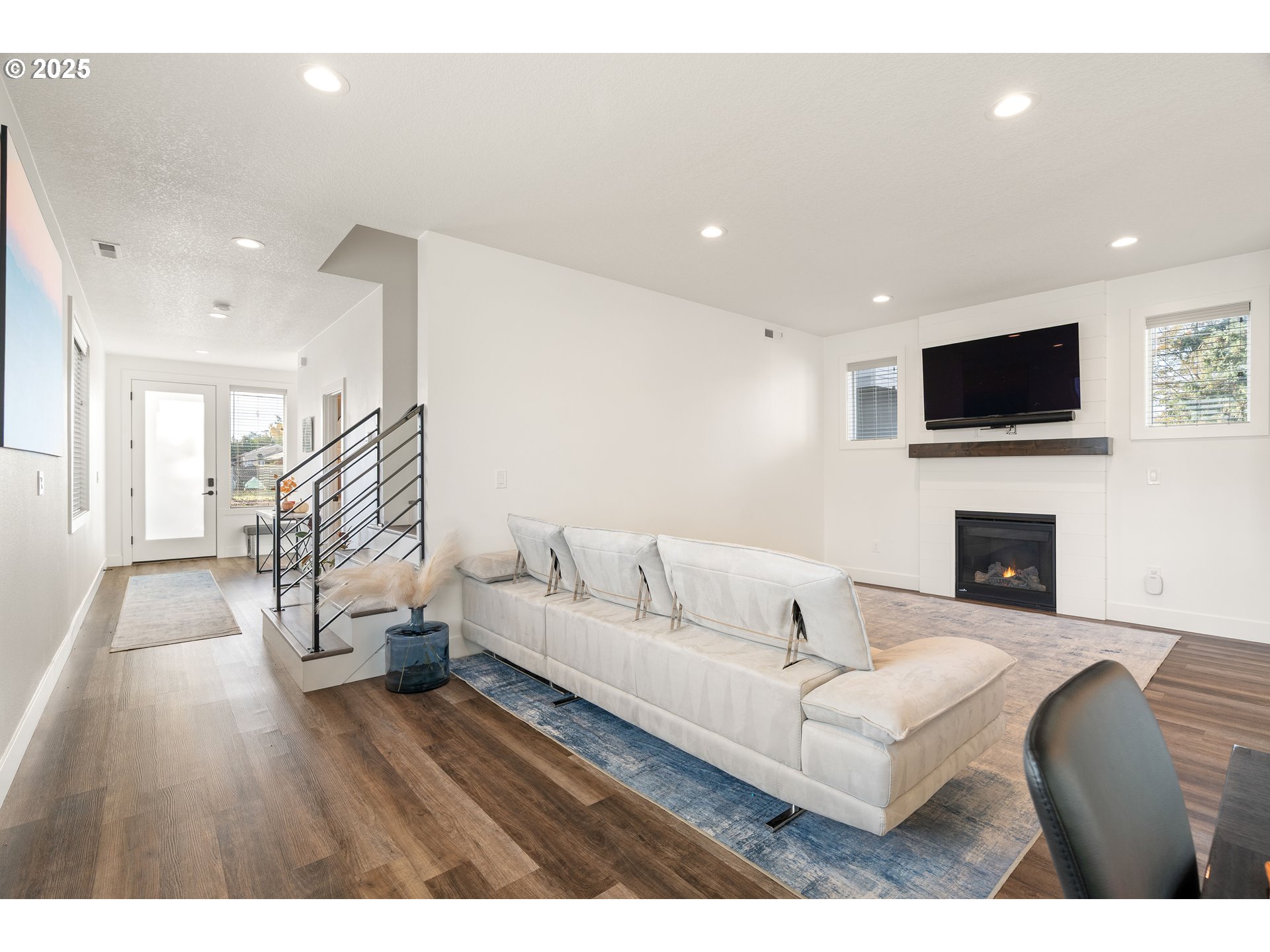 6421 Southeast Cooper Street Portland, OR 97206 - Photo 12 of 44 a living room with fireplace furniture and a flat screen tv